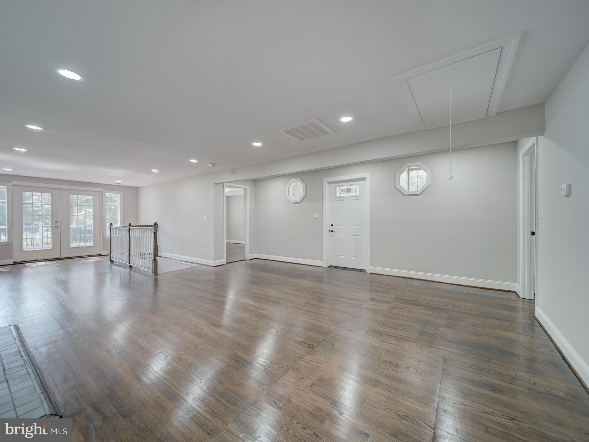 401 Bryan Point Road Accokeek, MD 20607 - Photo 6 of 48 a view of an empty room with wooden floor and a window