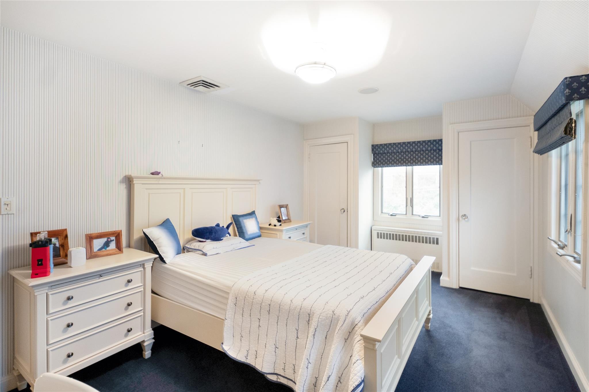 20 Sussex Road Great Neck, NY 11020 - Photo 15 of 27 a bedroom with a bed and a window