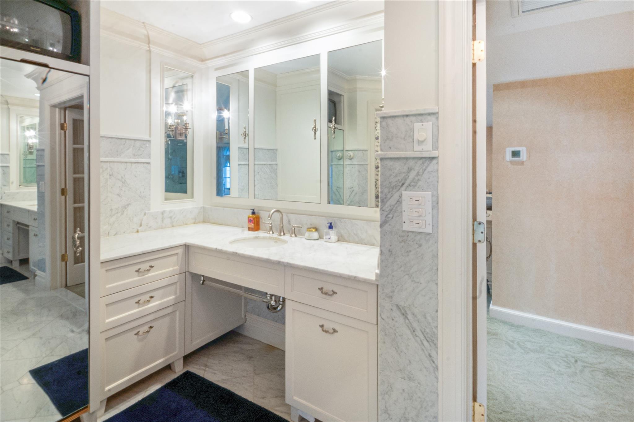 20 Sussex Road Great Neck, NY 11020 - Photo 19 of 27 a spacious bathroom with a double vanity sink a mirror and a shower