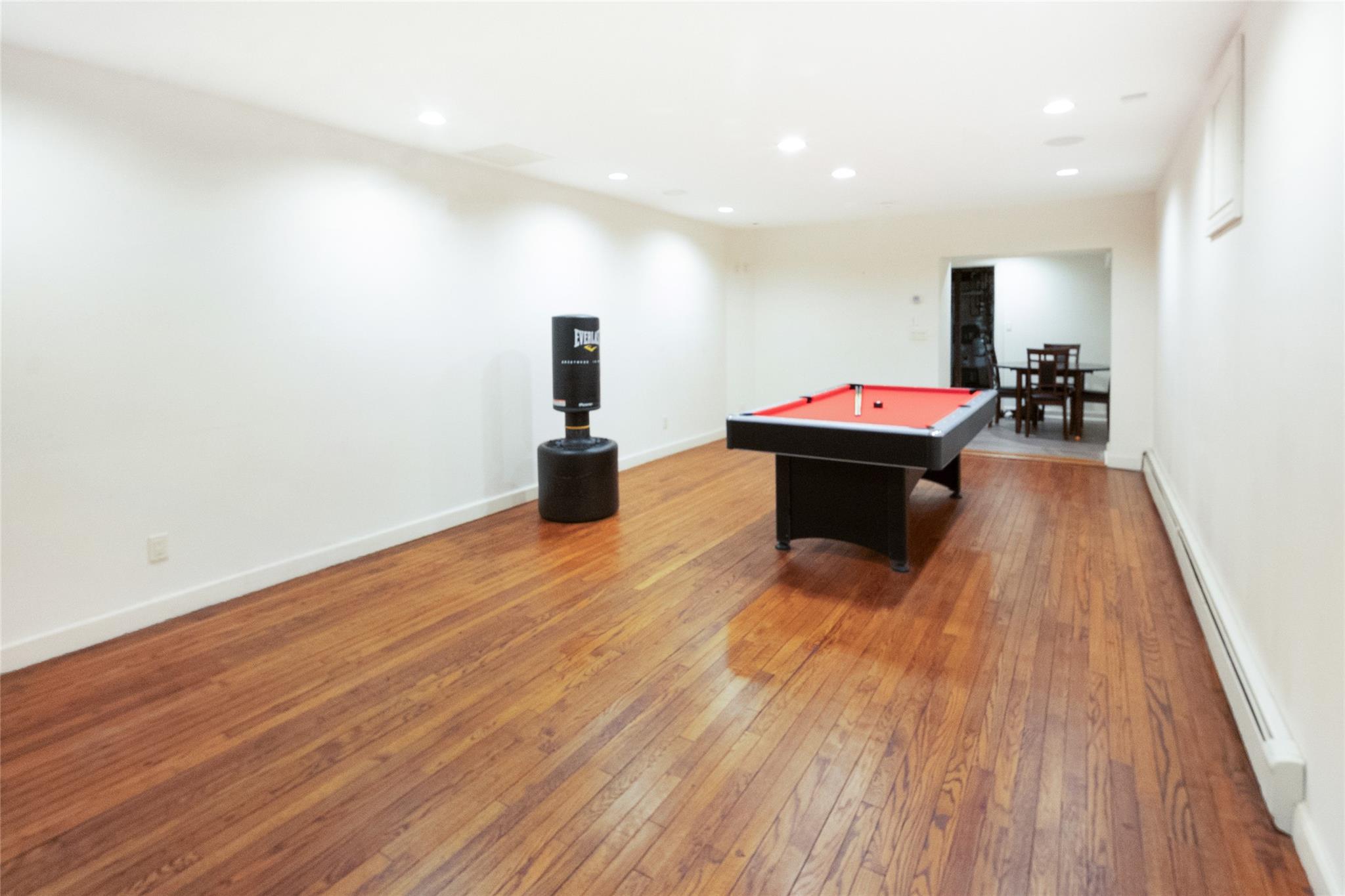 20 Sussex Road Great Neck, NY 11020 - Photo 2 of 27 a view of a room with wooden floor and furniture