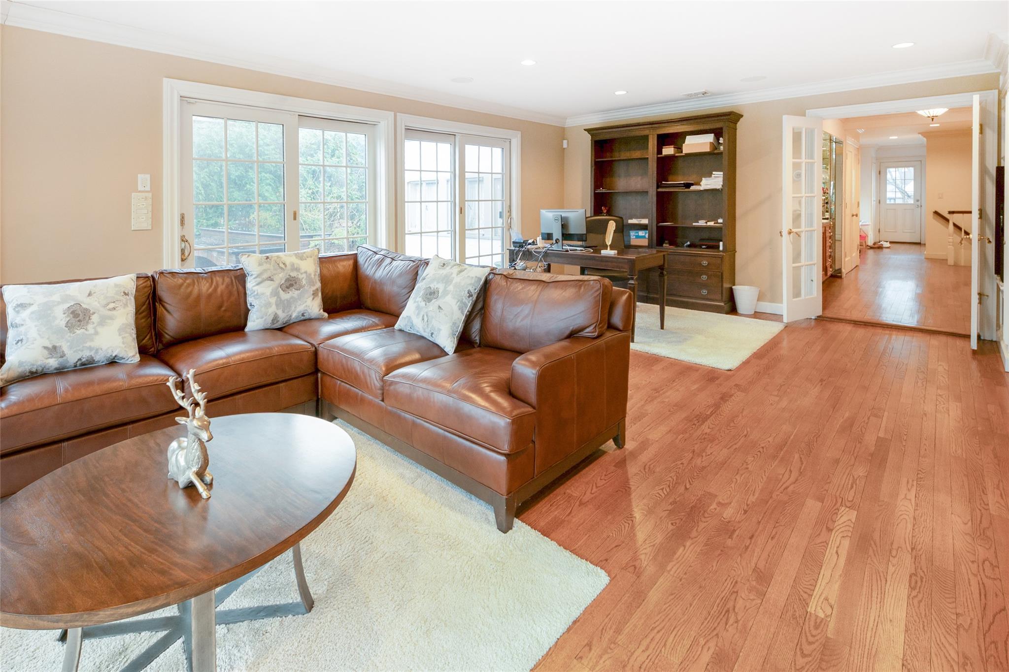 20 Sussex Road Great Neck, NY 11020 - Photo 4 of 27 a living room with furniture and a large window