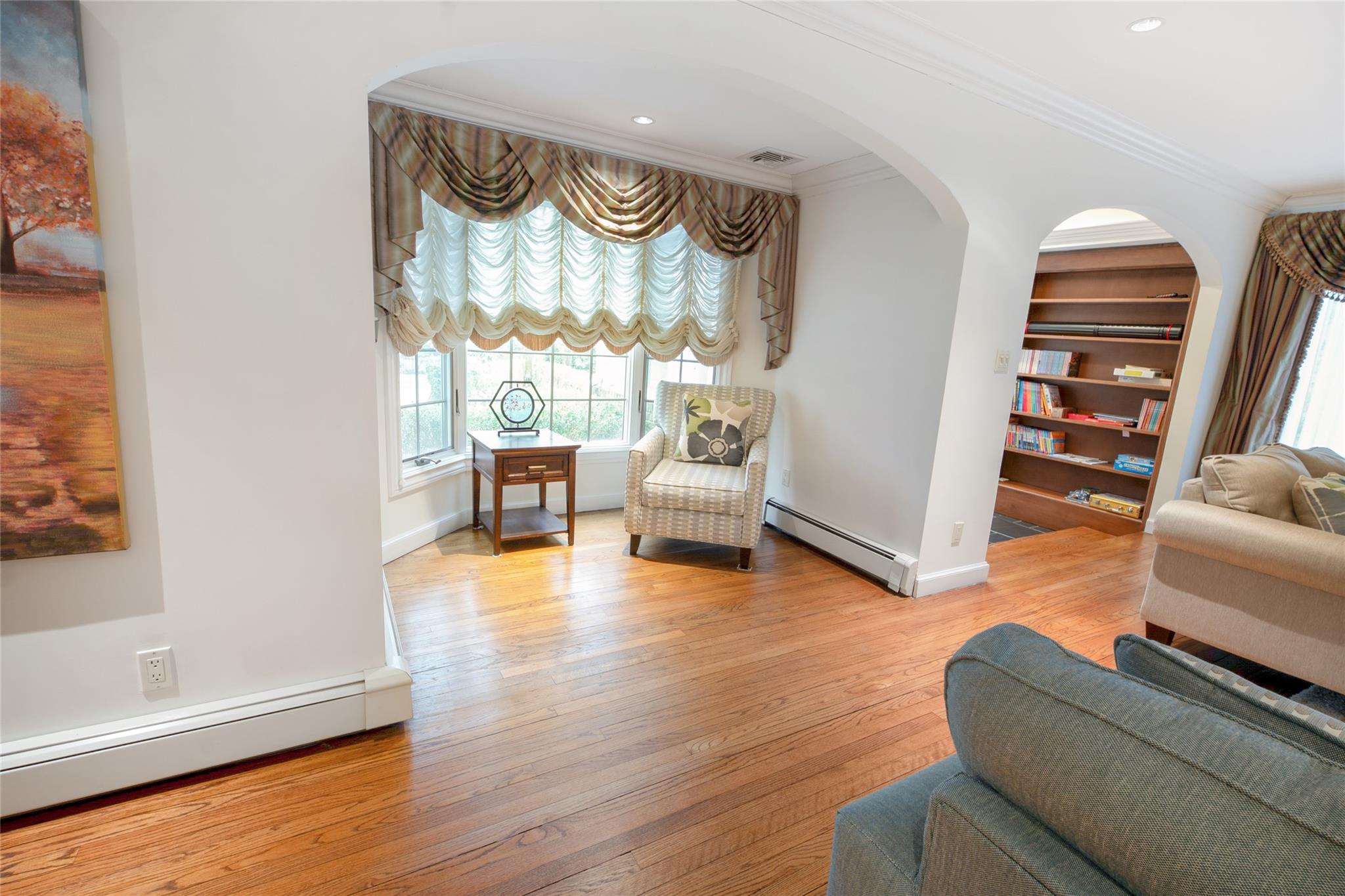 20 Sussex Road Great Neck, NY 11020 - Photo 7 of 27 a living room with furniture and a wooden floor
