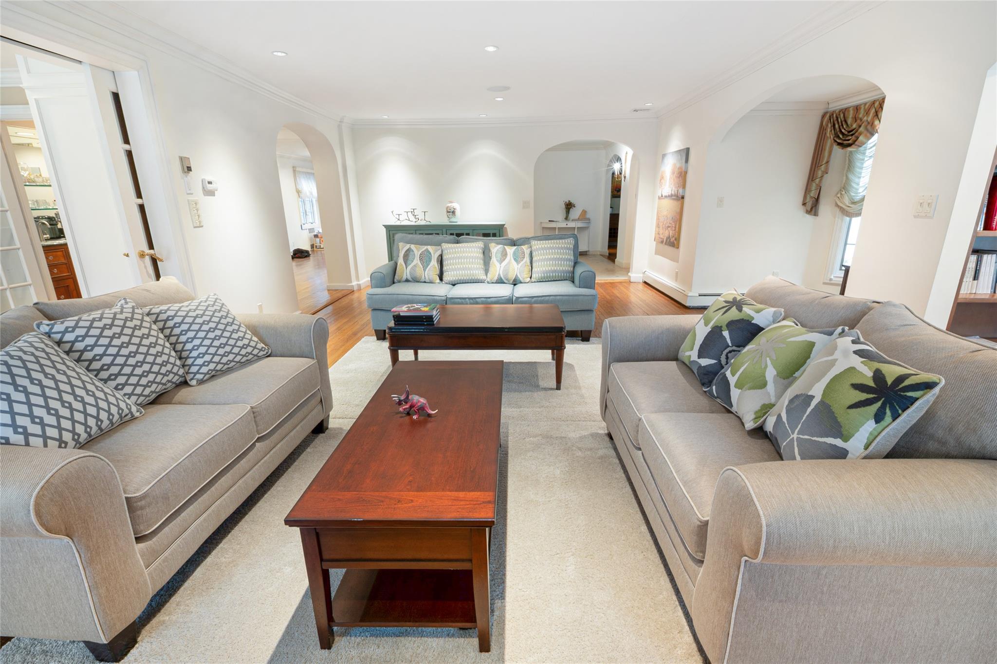 20 Sussex Road Great Neck, NY 11020 - Photo 9 of 27 a living room with furniture and a wooden floor