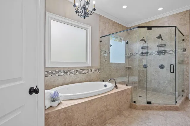 a bathroom with a bathtub and a shower