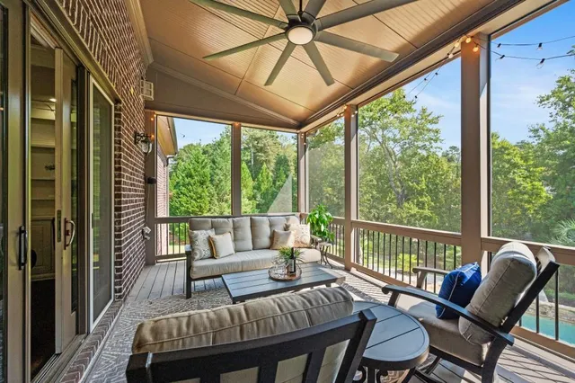a balcony with furniture and wooden floor
