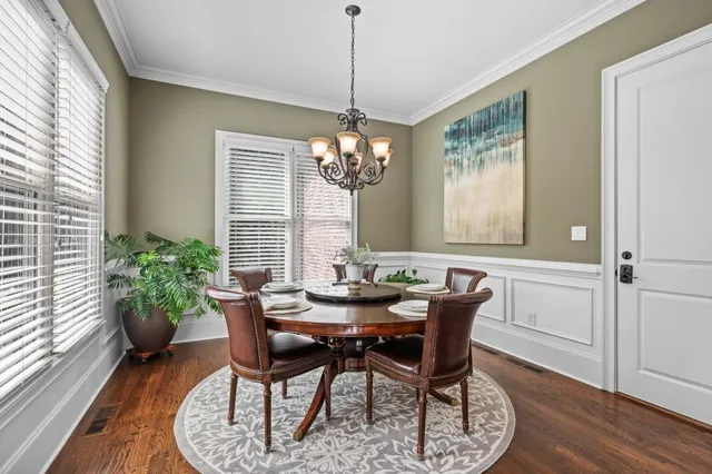 a view of a hallway with the wooden floor and staircase