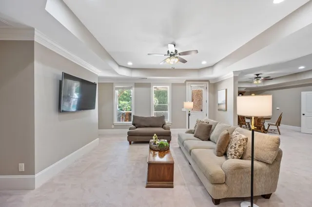 a dining room with furniture and chandelier