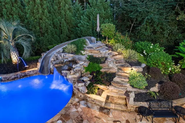 a view of a swimming pool with an outdoor seating
