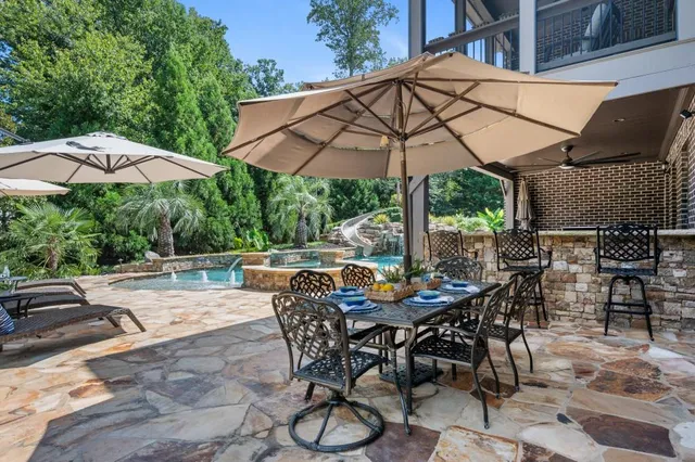a view of a swimming pool with a patio