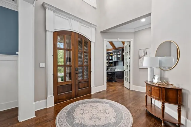 a view of a livingroom with furniture and staircase
