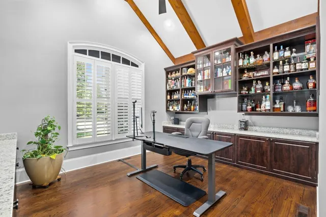 a workspace with furniture and a potted plant