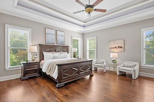 a bed room with a bed and a chair