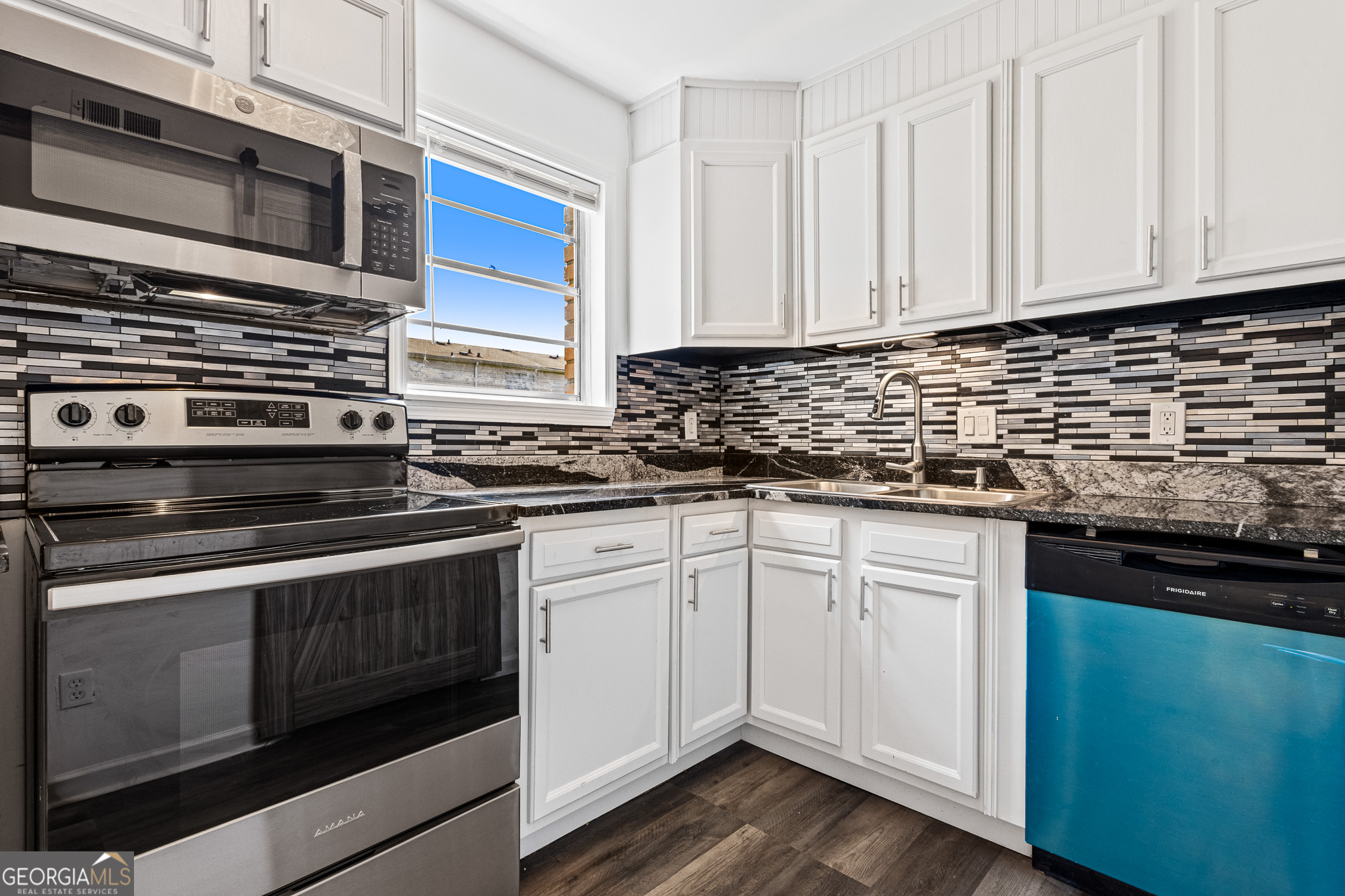 4701 Flat Shoals Road, Unit 47A Union City, GA 30291 - Photo 12 of 29 a kitchen with granite countertop cabinets stainless steel appliances and sink