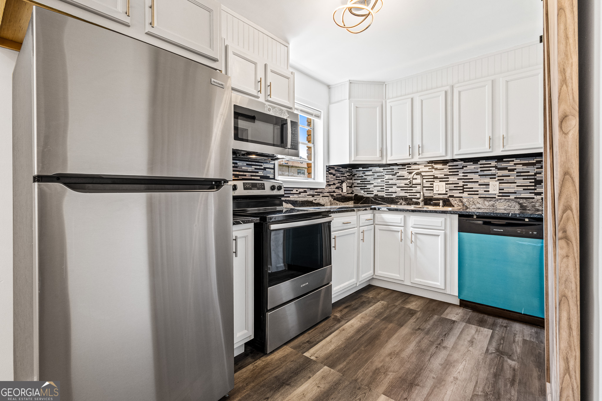 4701 Flat Shoals Road, Unit 47A Union City, GA 30291 - Photo 13 of 29 a kitchen with white cabinets and white appliances