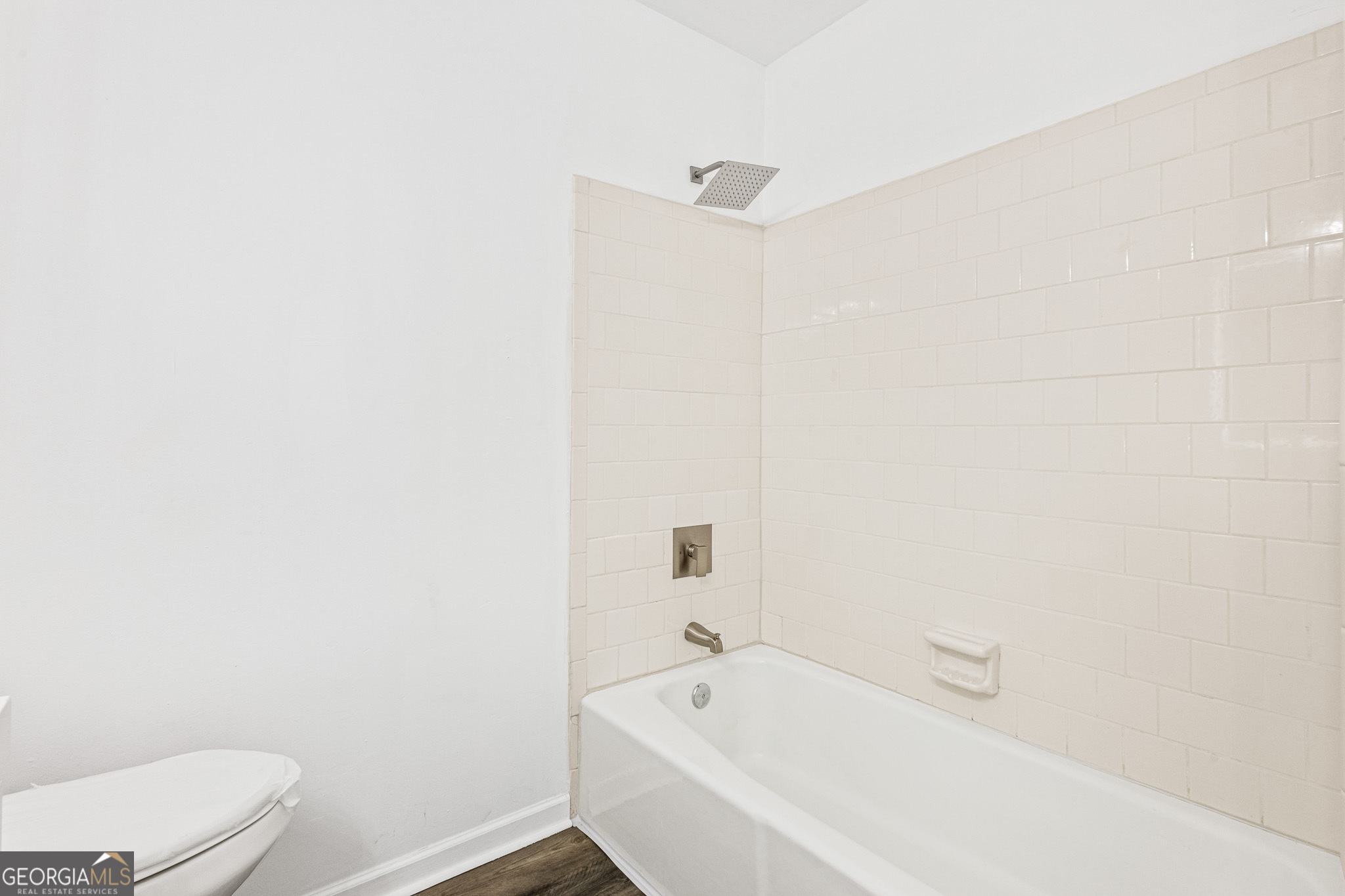 4701 Flat Shoals Road, Unit 47A Union City, GA 30291 - Photo 17 of 29 a white bath tub sitting next to a white toilet