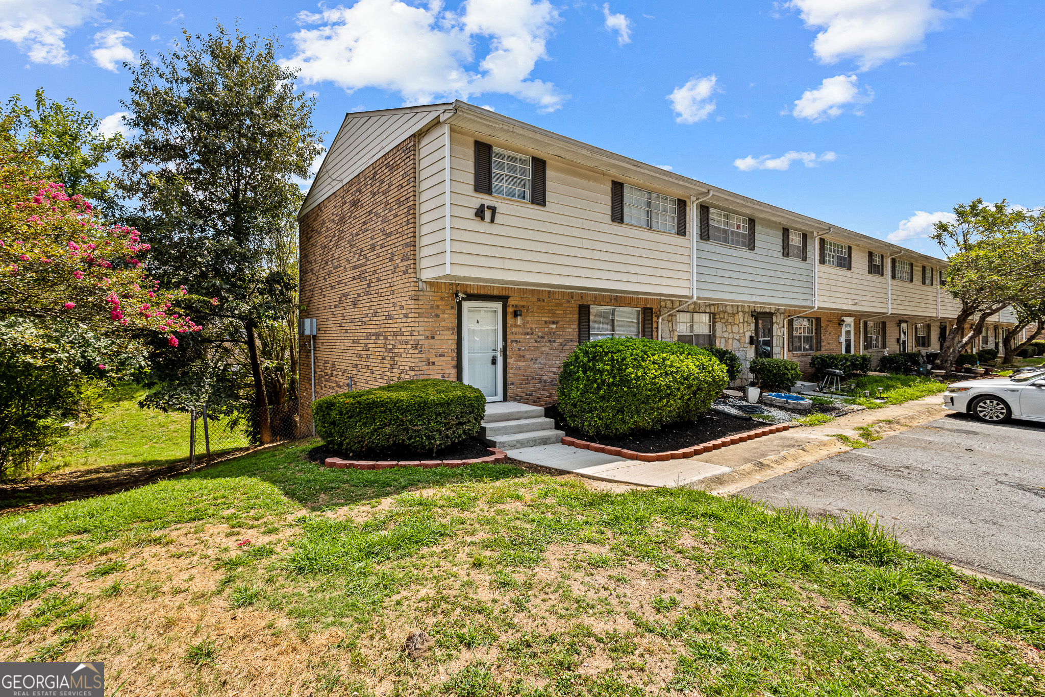 4701 Flat Shoals Road, Unit 47A Union City, GA 30291 - Photo 2 of 29 a front view of a house with garden