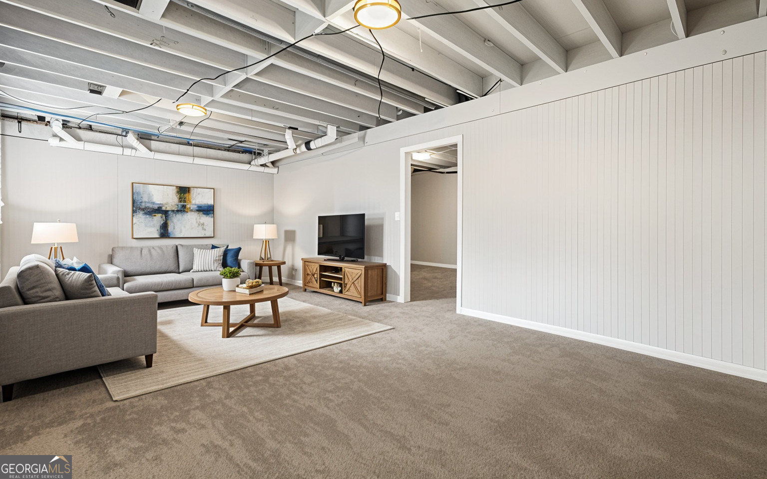 4701 Flat Shoals Road, Unit 47A Union City, GA 30291 - Photo 22 of 29 a living room with furniture and a flat screen tv