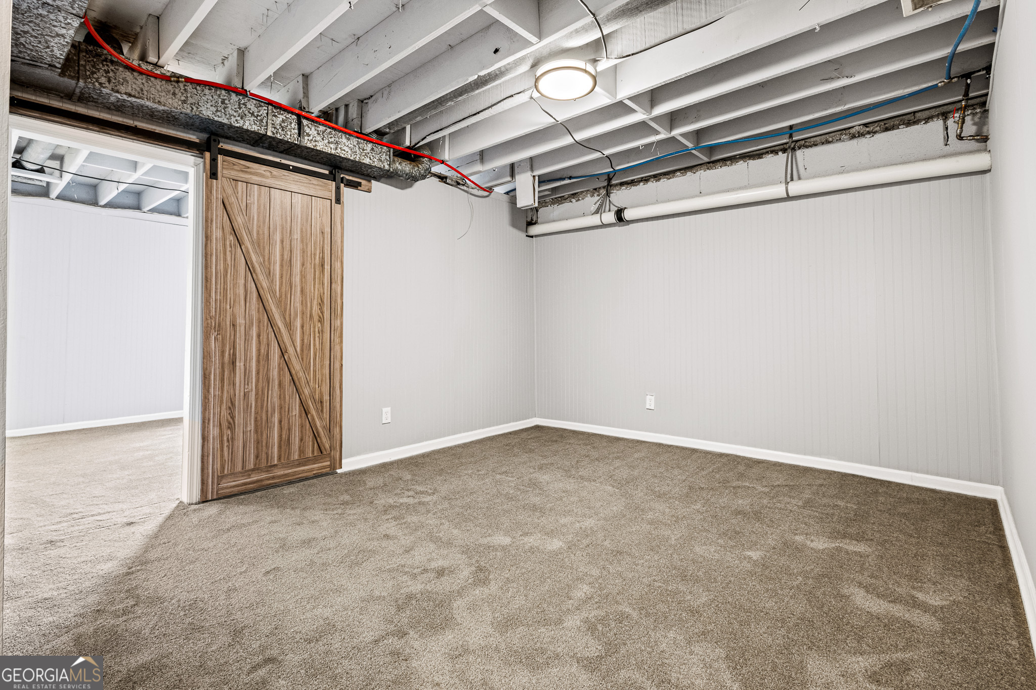 4701 Flat Shoals Road, Unit 47A Union City, GA 30291 - Photo 24 of 29 a view of a room with racks on the wall