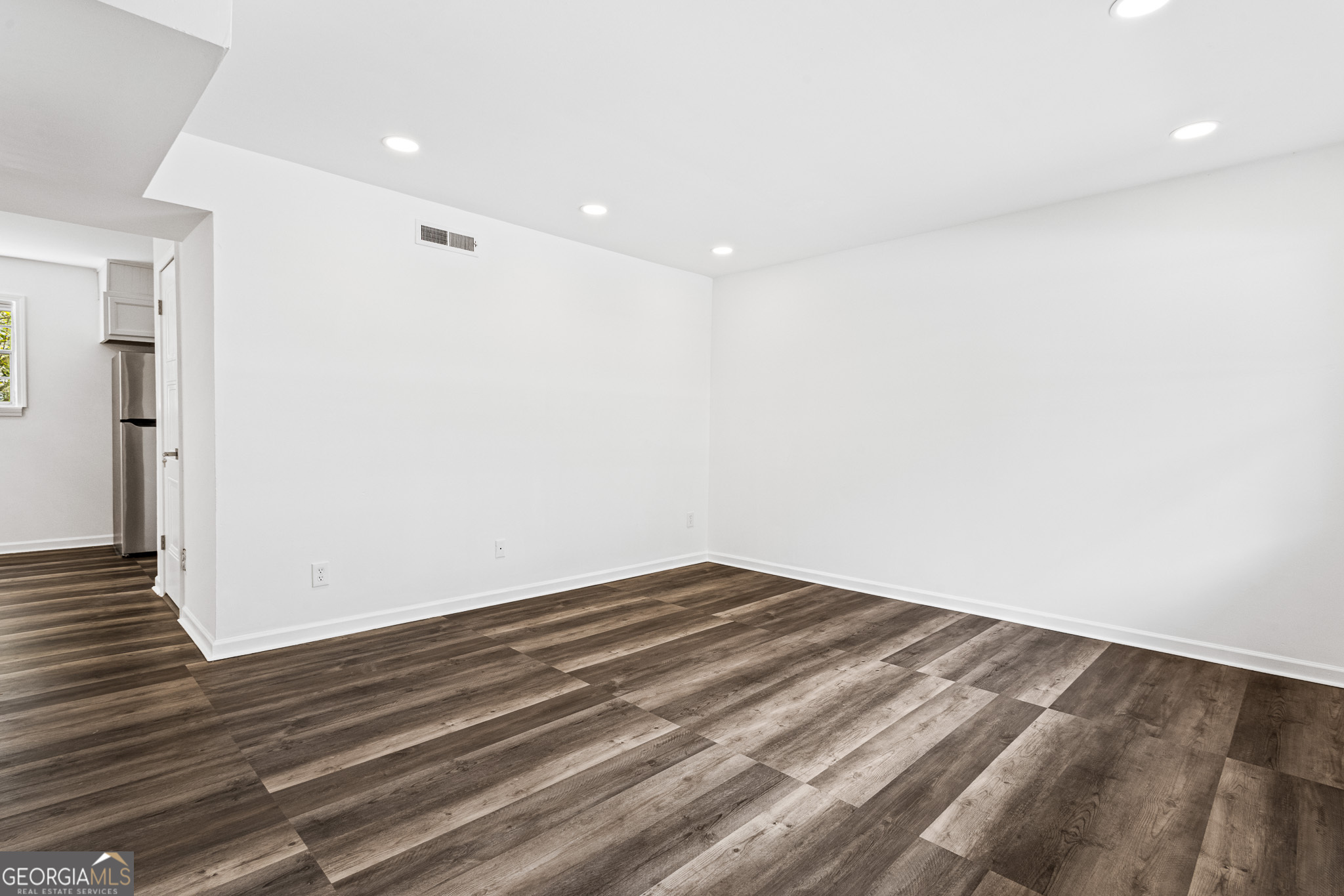 4701 Flat Shoals Road, Unit 47A Union City, GA 30291 - Photo 4 of 29 a view of empty room with wooden floor