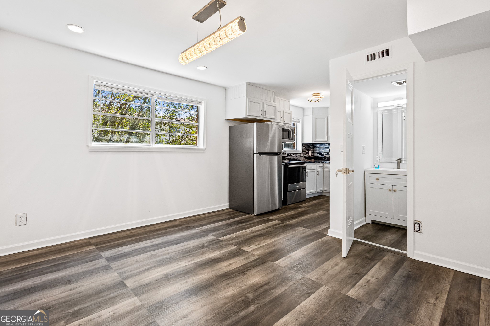 4701 Flat Shoals Road, Unit 47A Union City, GA 30291 - Photo 7 of 29 a view of kitchen with refrigerator microwave and cabinets
