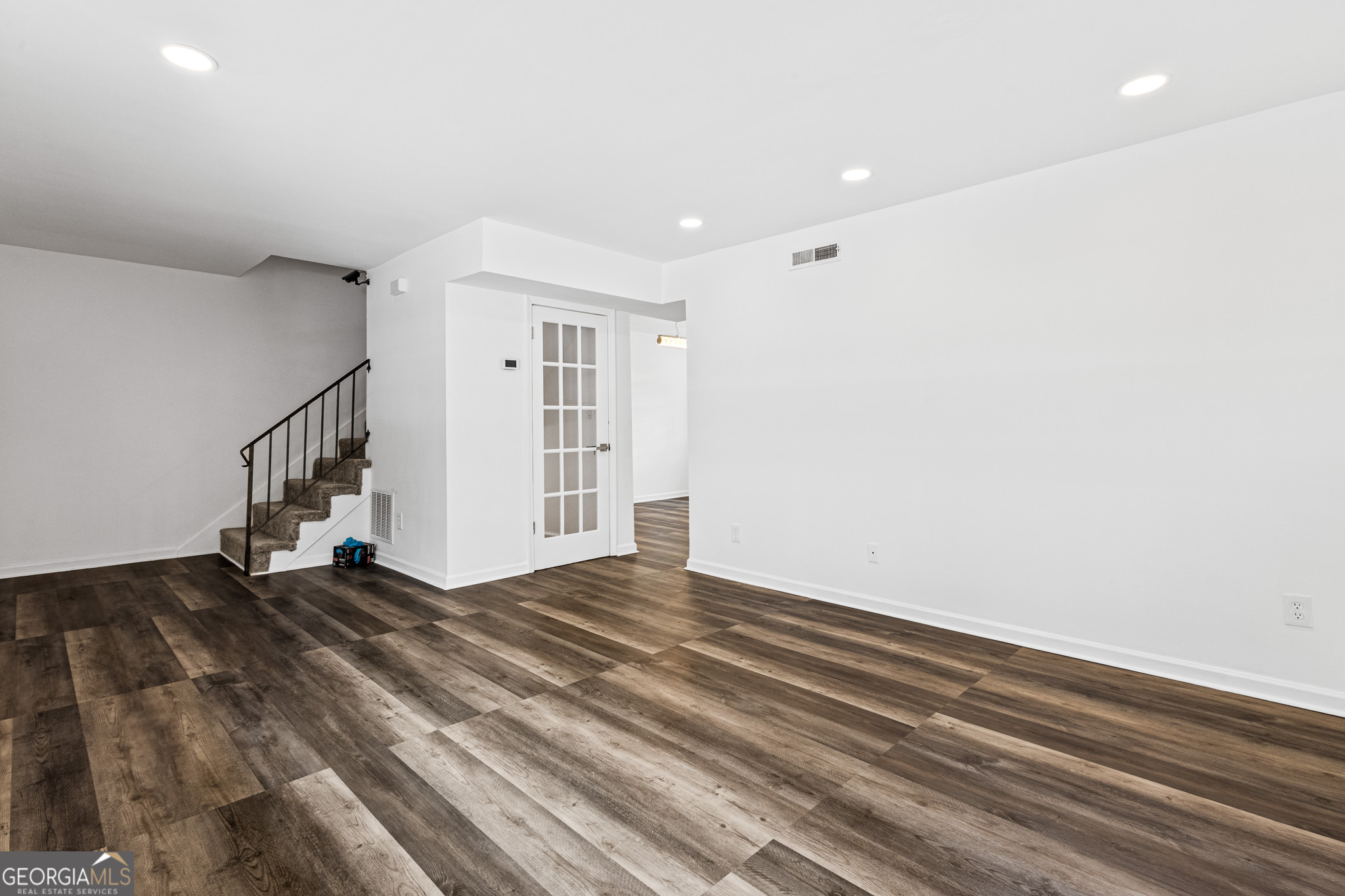 4701 Flat Shoals Road, Unit 47A Union City, GA 30291 - Photo 10 of 29 a view of an empty room with stairs and a window