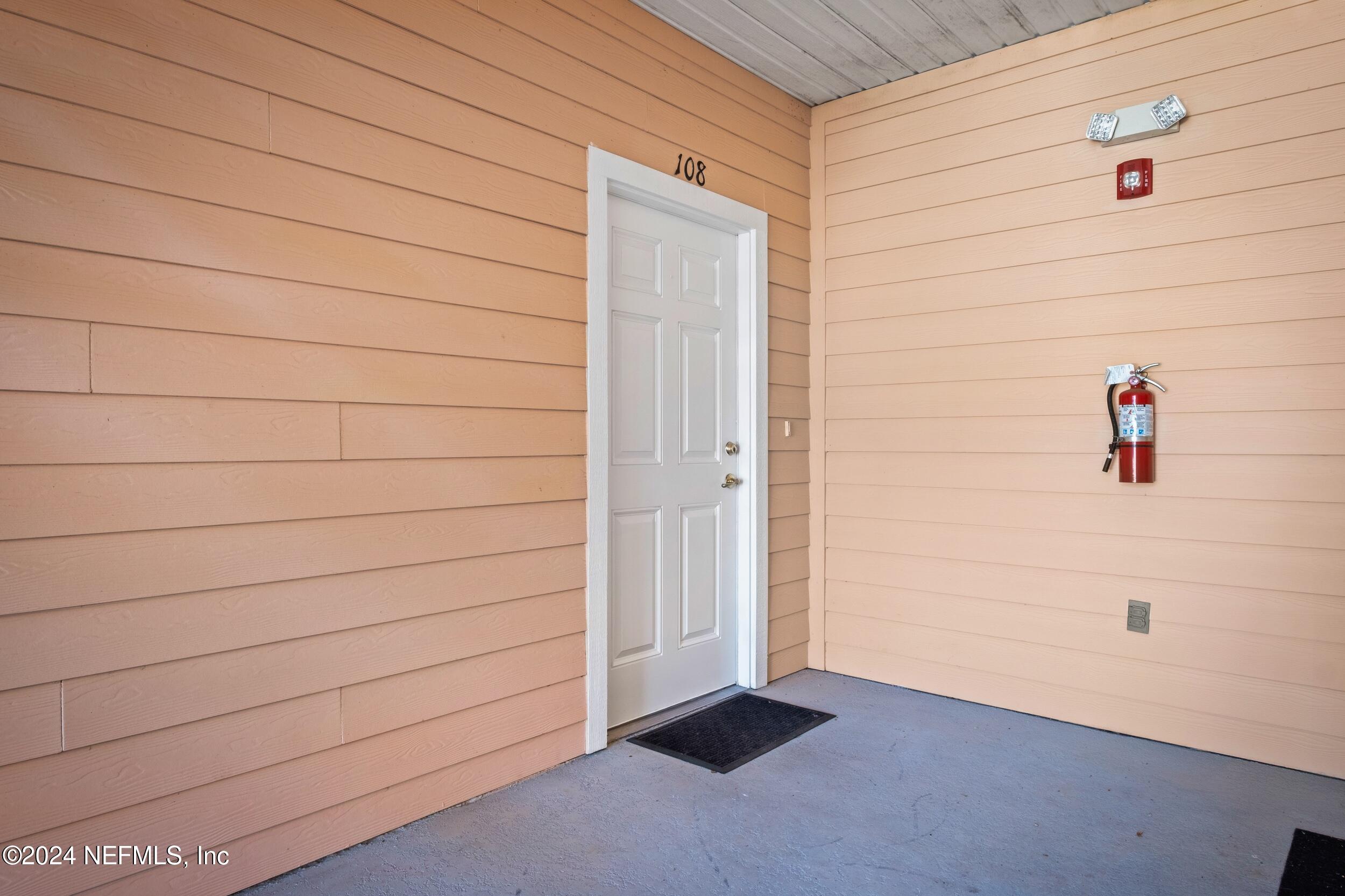 8218 Green Parrot Road, Unit 108 Jacksonville, FL 32256 - Photo 3 of 29 Front Doo