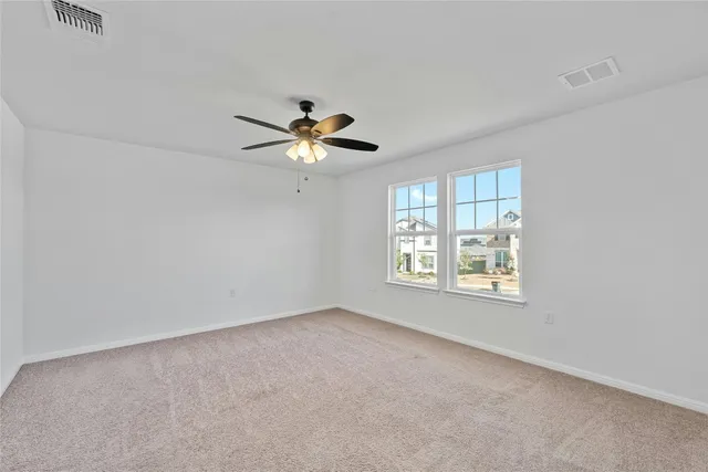 a large kitchen with cabinets and stainless steel appliances