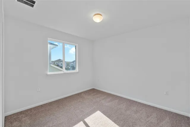 a bathroom with a sink a toilet a mirror and shower