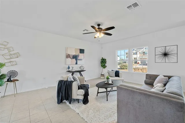 a living room with furniture and a window