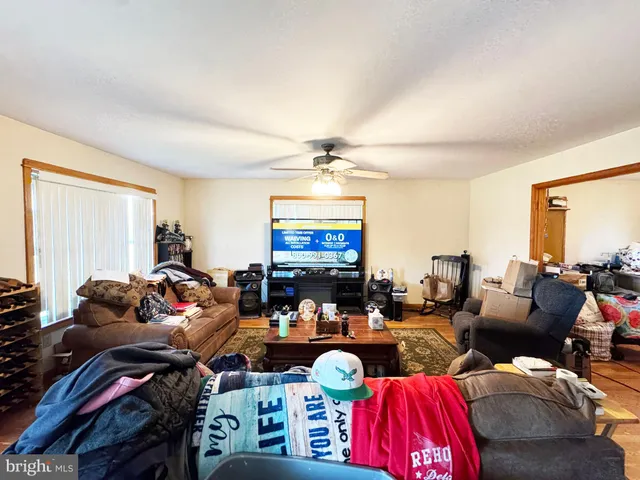 a living room with furniture toys and a flat screen tv