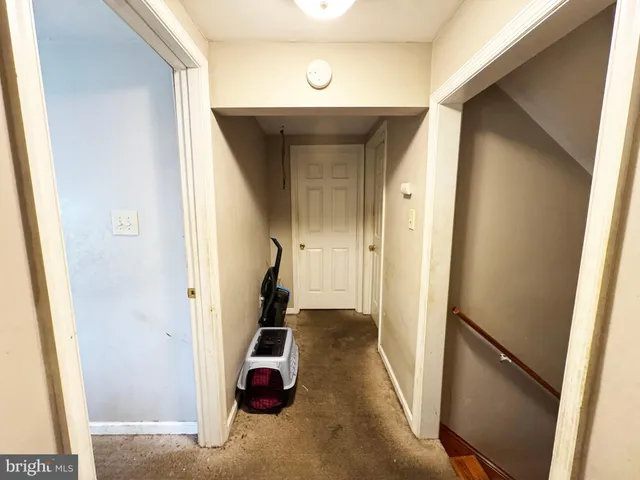 a bedroom with bed and a chandelier