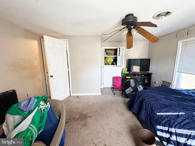 a bedroom with furniture and a bed