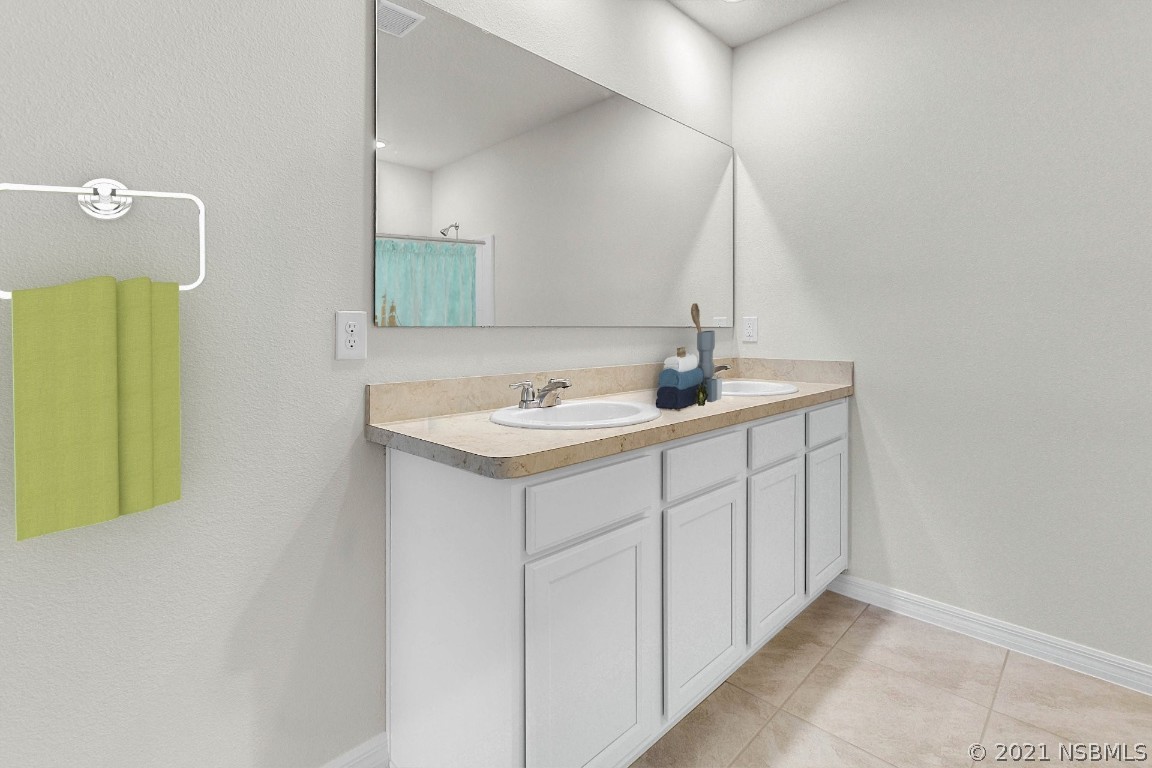 101 Old Mill Pond Road Palm Harbor, FL 34683 - Photo 11 of 20 a bathroom with a sink and a mirror