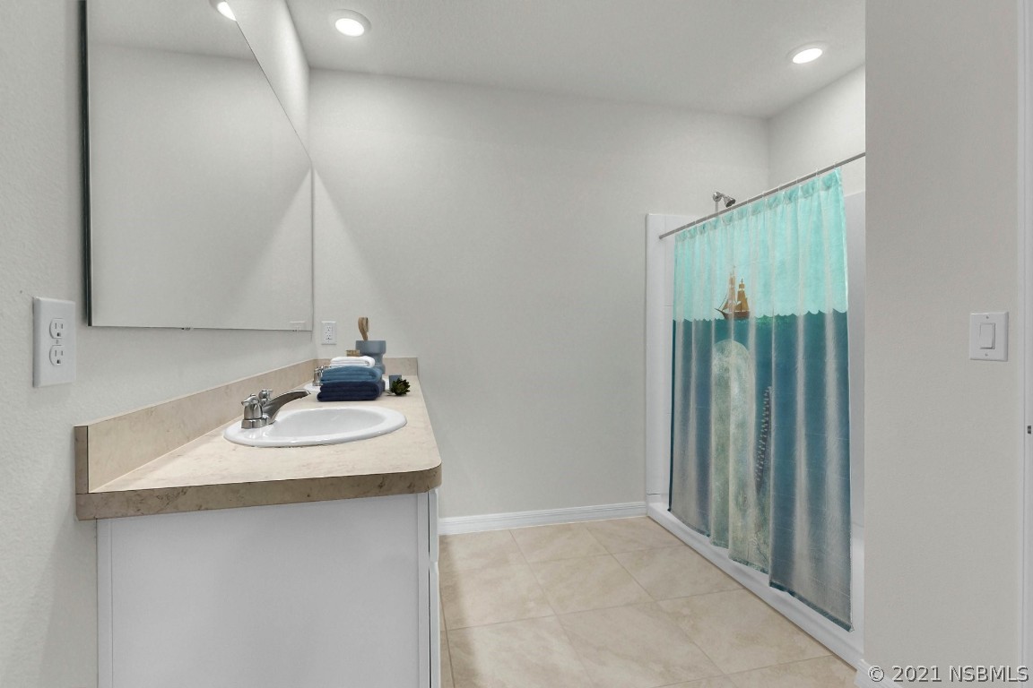 101 Old Mill Pond Road Palm Harbor, FL 34683 - Photo 15 of 20 a bathroom with a sink and a mirror