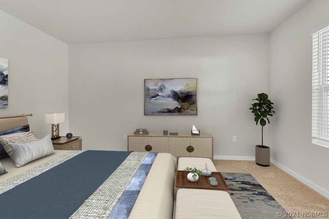 101 Old Mill Pond Road Palm Harbor, FL 34683 - Photo 16 of 20 a bed room with furniture and a potted plant