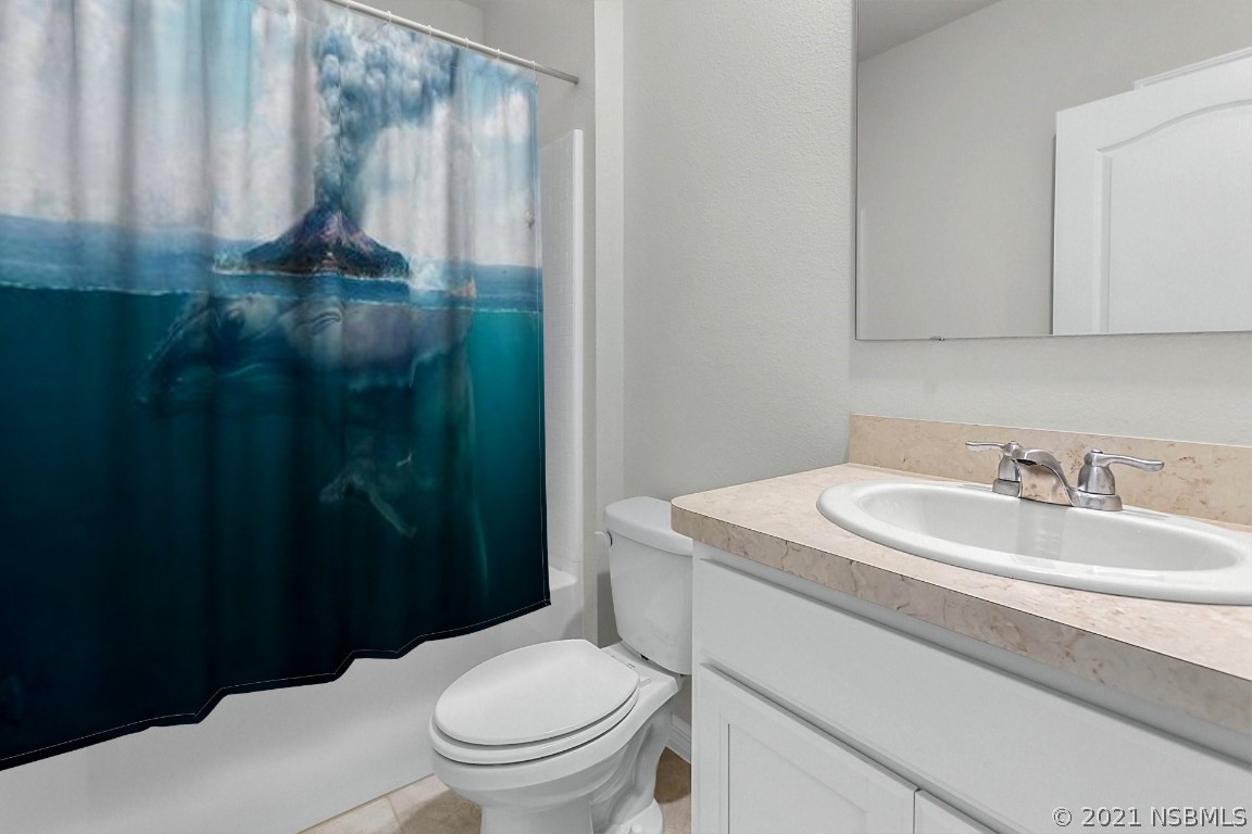 101 Old Mill Pond Road Palm Harbor, FL 34683 - Photo 17 of 20 a bathroom with a sink a toilet and shower