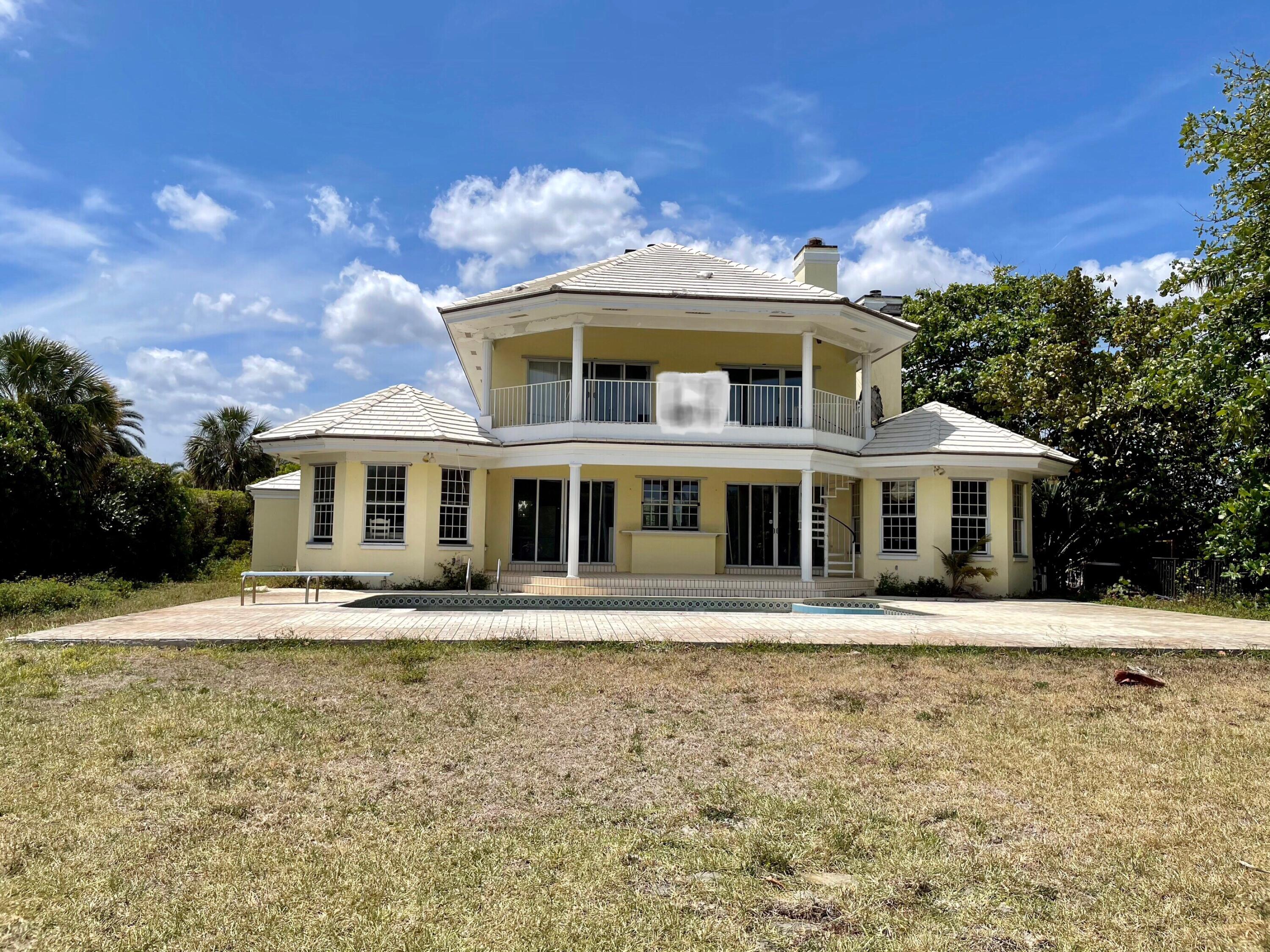 2900 Ave Au Soleil Delray Beach, FL 33483 - Photo 15 of 18 a front view of a house with a yard