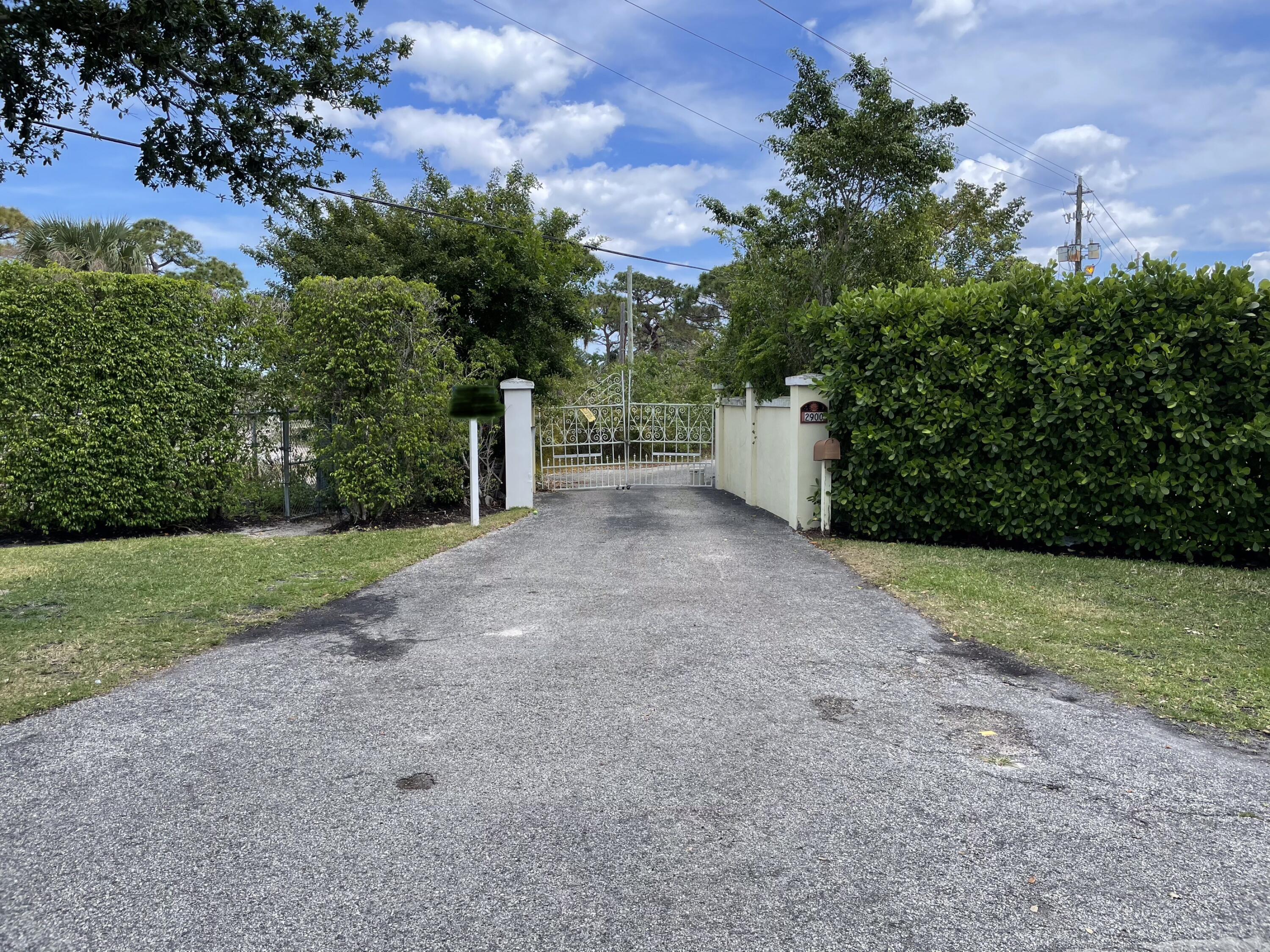 2900 Ave Au Soleil Delray Beach, FL 33483 - Photo 2 of 18 a view of a yard with a tree