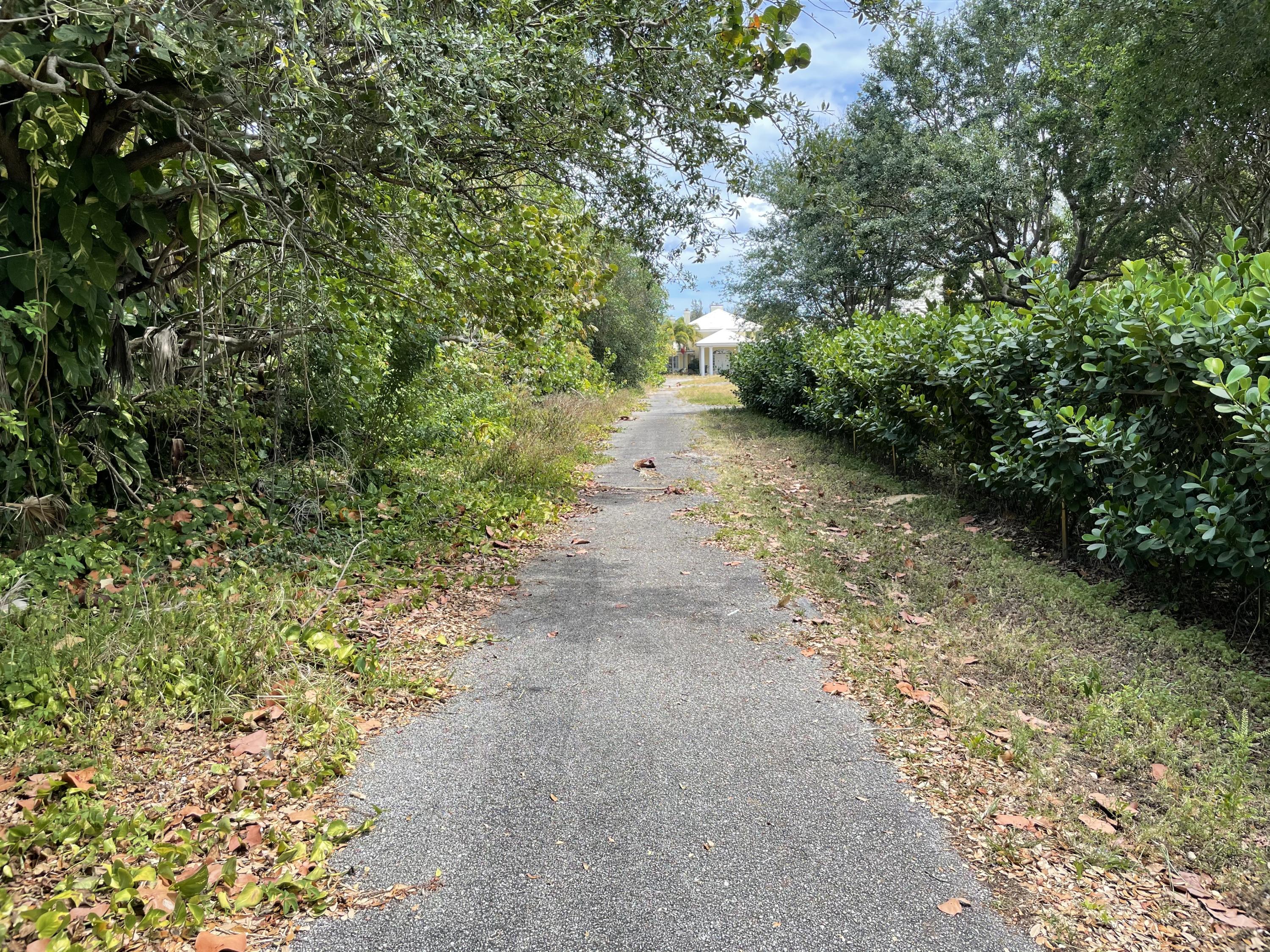 2900 Ave Au Soleil Delray Beach, FL 33483 - Photo 4 of 18 a view of a pathway with a yard