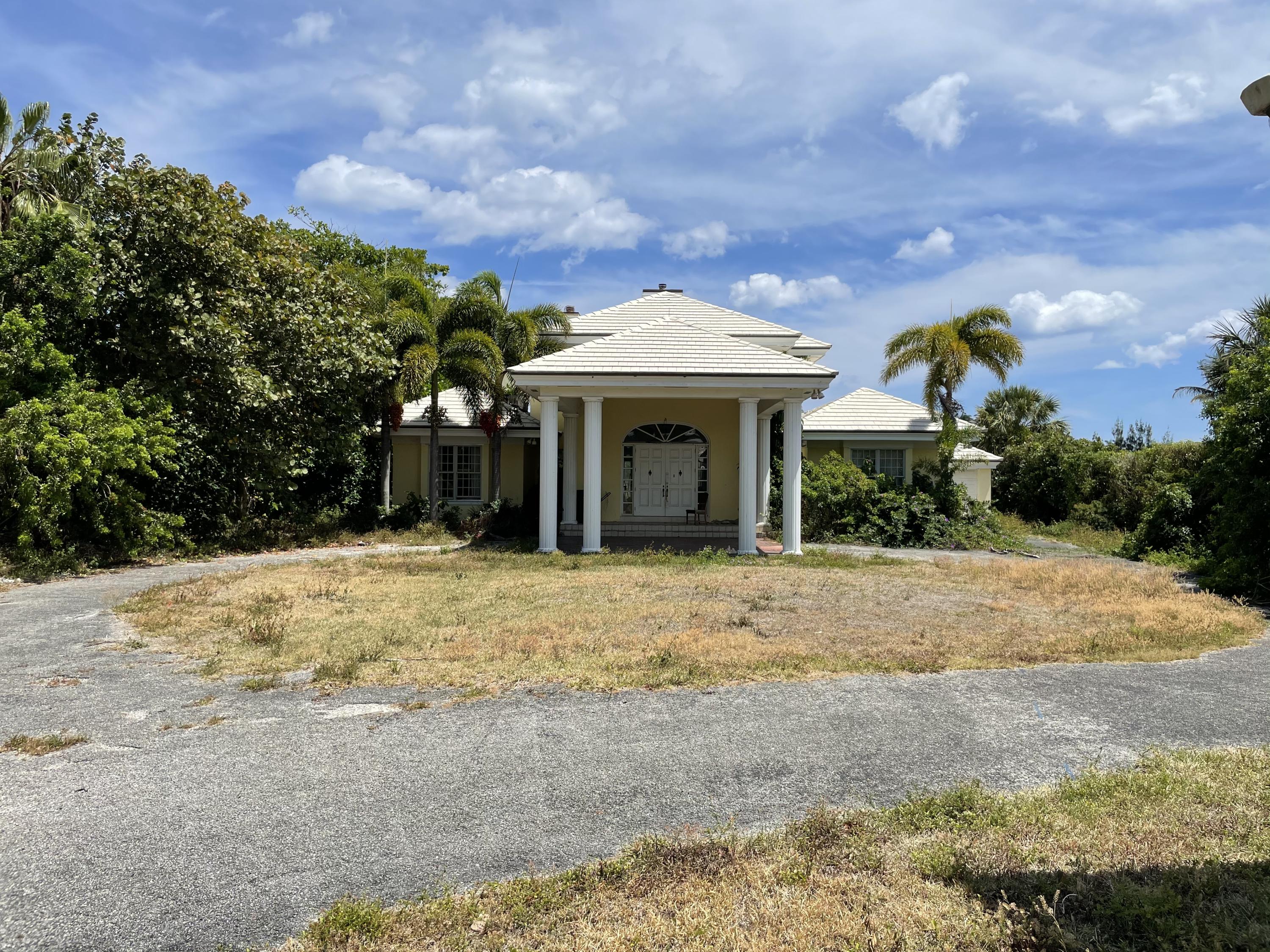 2900 Ave Au Soleil Delray Beach, FL 33483 - Photo 8 of 18 a front view of a house with a yard and garage