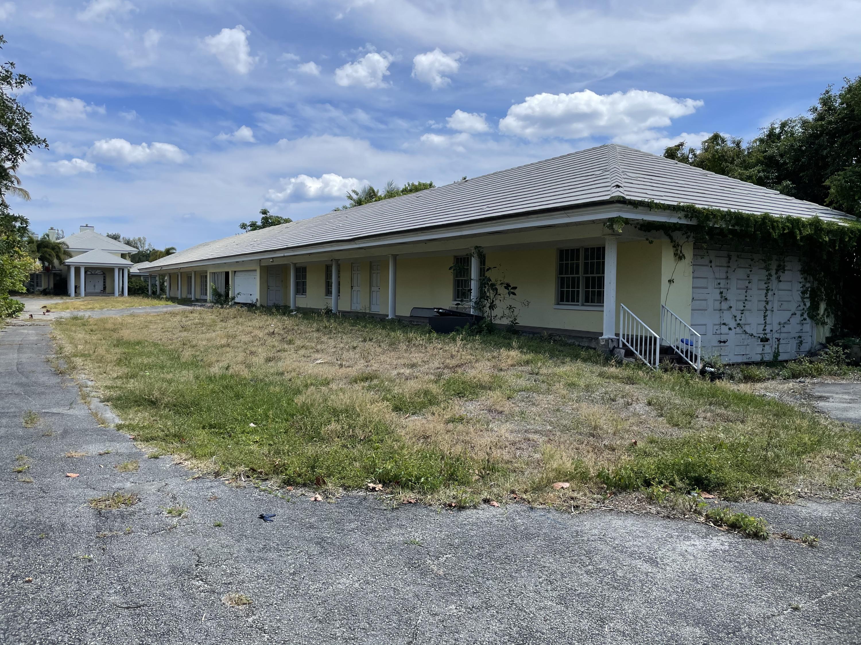 2900 Ave Au Soleil Delray Beach, FL 33483 - Photo 10 of 18 a view of a house with a yard