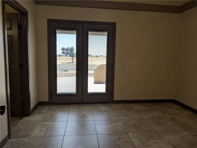 a view of an empty room and window