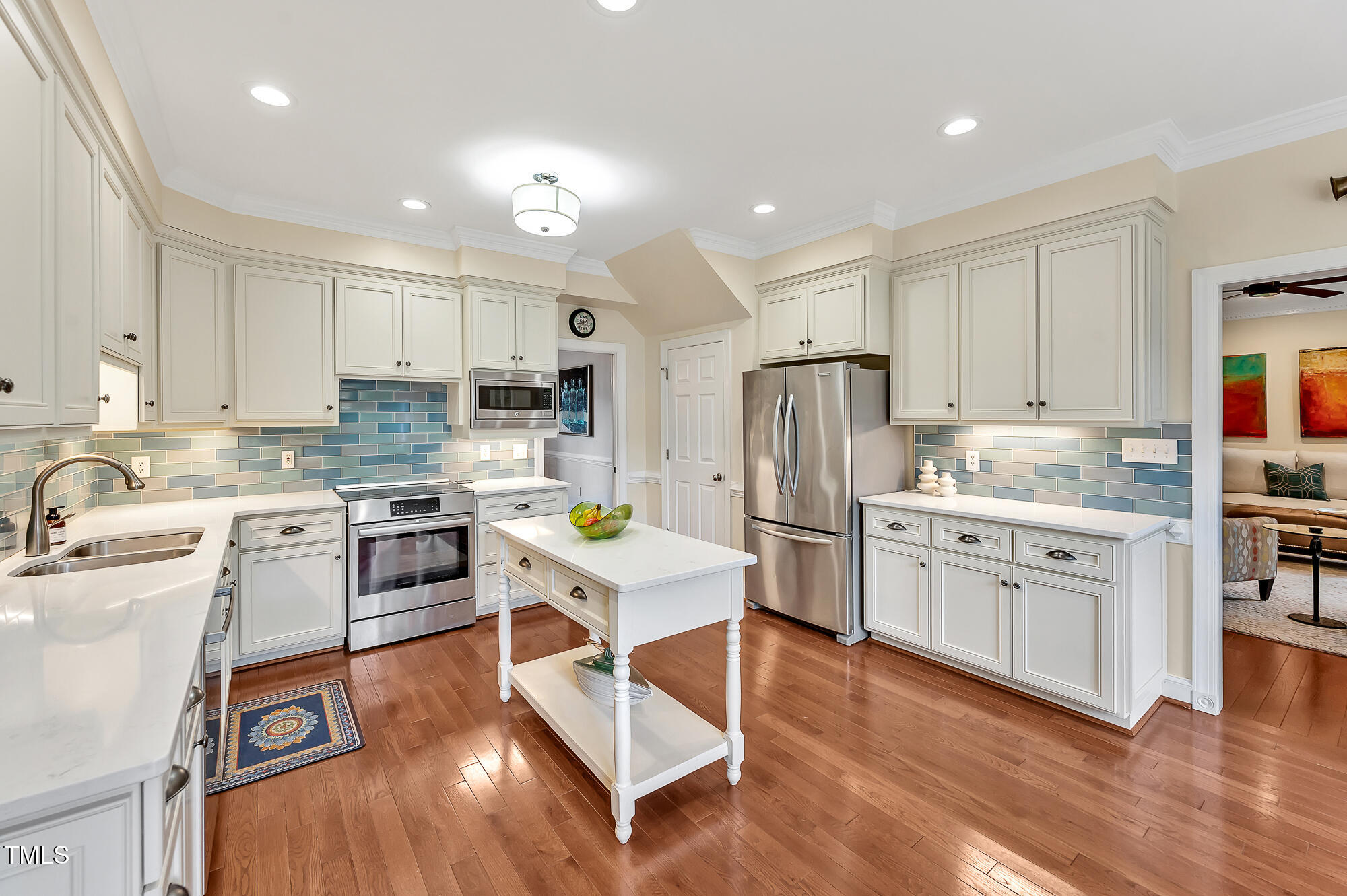 14 Marigold Place Durham, NC 27705 - Photo 12 of 32 a kitchen with white cabinets stove and refrigerator