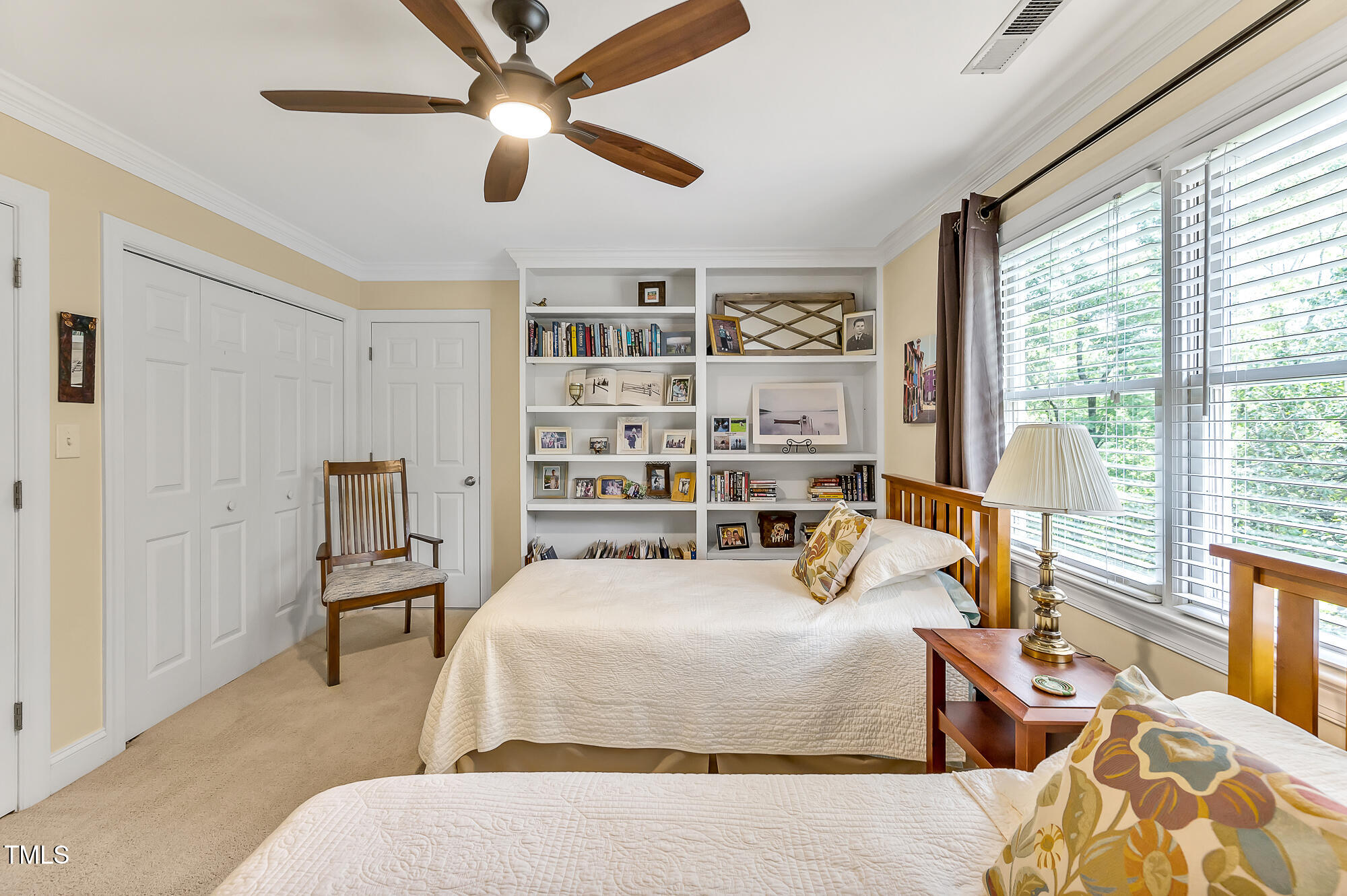 14 Marigold Place Durham, NC 27705 - Photo 30 of 32 a bedroom with a bed a large window with table and chairs