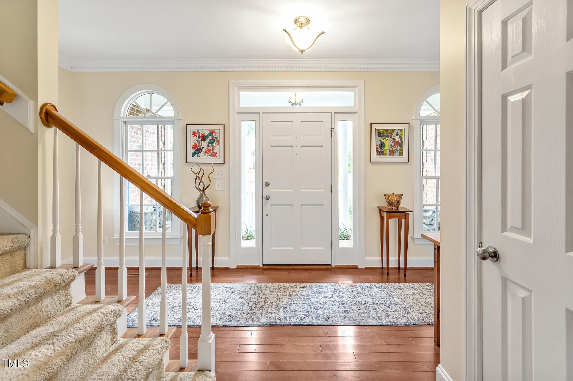 14 Marigold Place Durham, NC 27705 - Photo 5 of 32 a view of a hallway with wooden floor and staircase