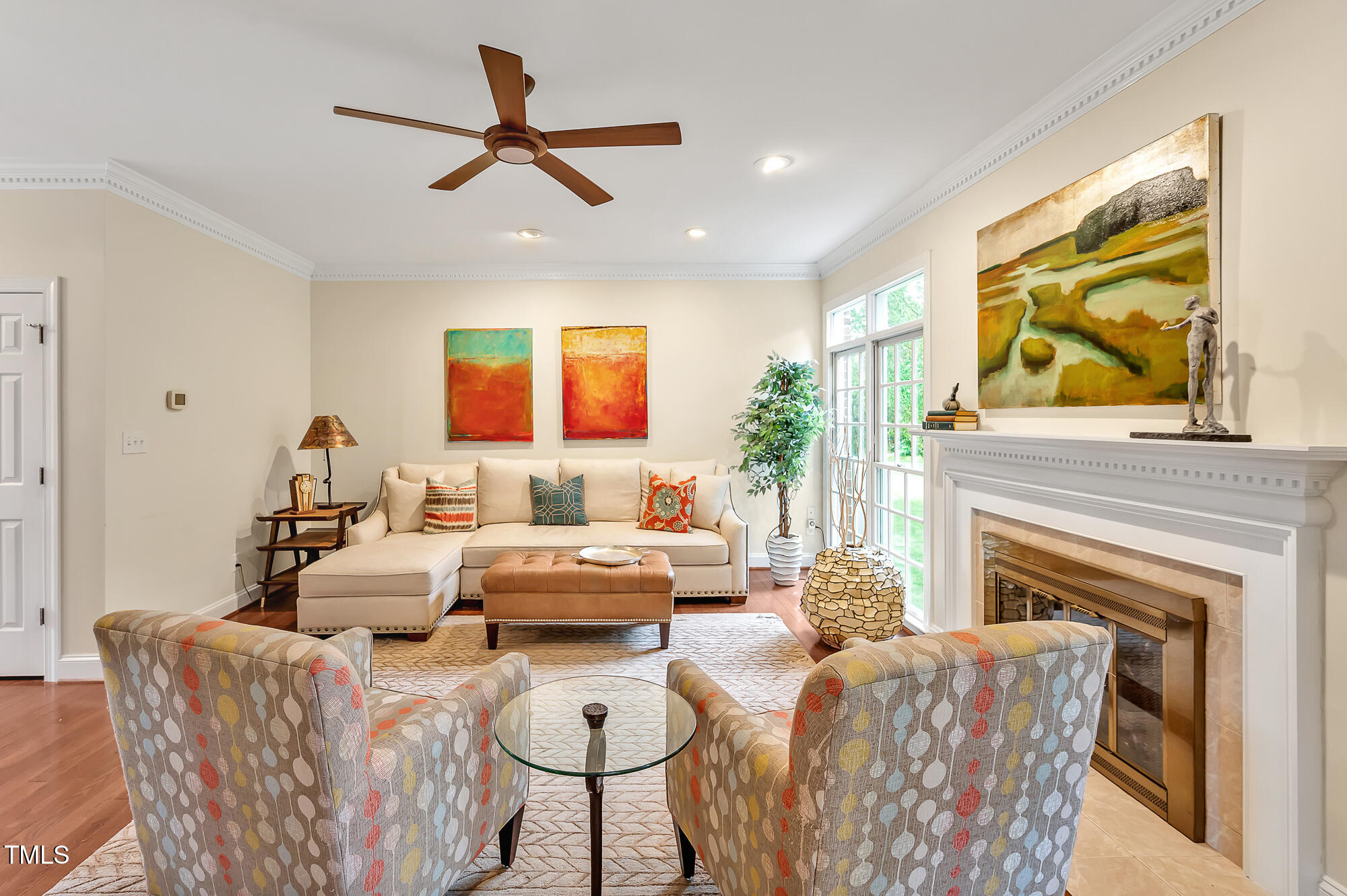 14 Marigold Place Durham, NC 27705 - Photo 9 of 32 a living room with furniture a fireplace and a flat screen tv