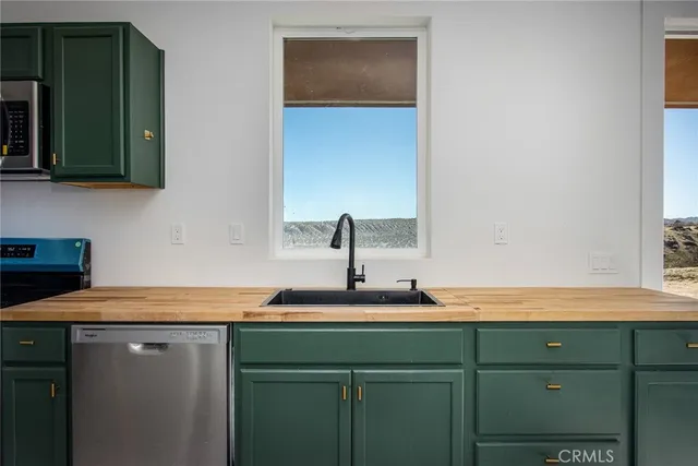 a spacious bedroom with a bed and cabinets