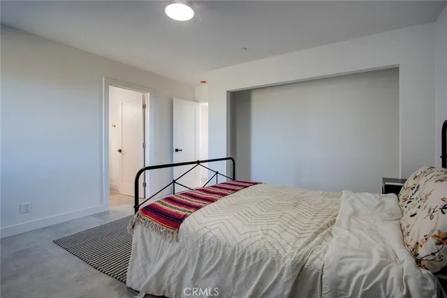 a bathroom with a sink vanity mirror and toilet