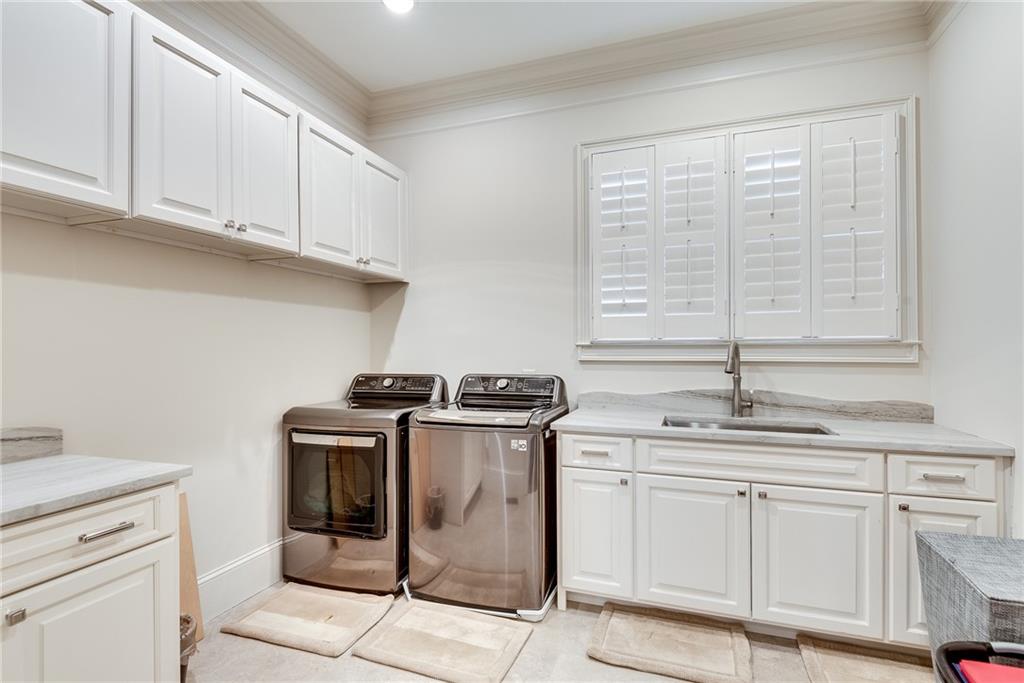 187 Fontaine Road Southwest Mableton, GA 30126 - Photo 40 of 84 a kitchen with stainless steel appliances granite countertop a stove a sink and a microwave