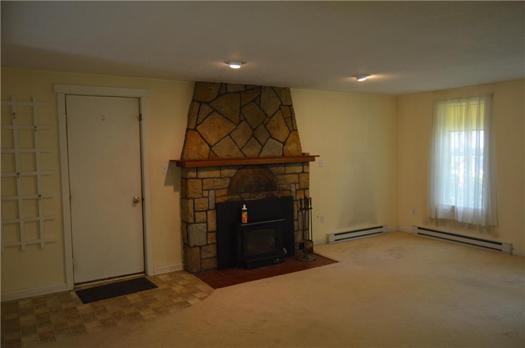 3244 Maple Lane Jamestown, PA 16134 - Photo 3 of 27 an empty room with windows and fireplace